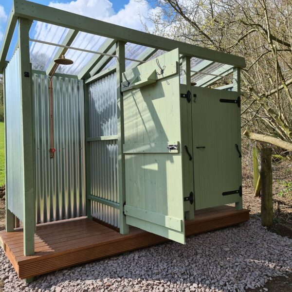 Outdoor showers at Wytch Wood Camping