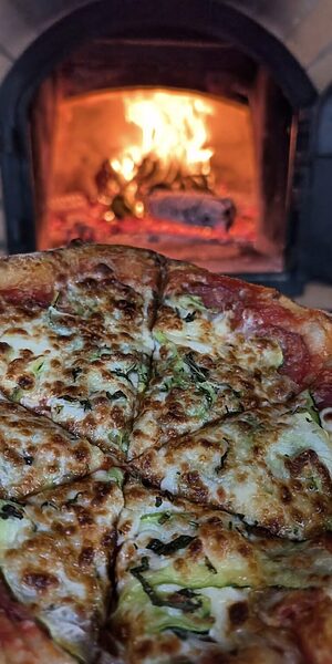 PIZZA AT WYTCH WOOD CAMPING & GLAMPING AN AWARD-WINNING, SUSTAINABLE WOODLAND CAMPING AND GLAMPING RETREAT IN SOUTH SOMERSET.